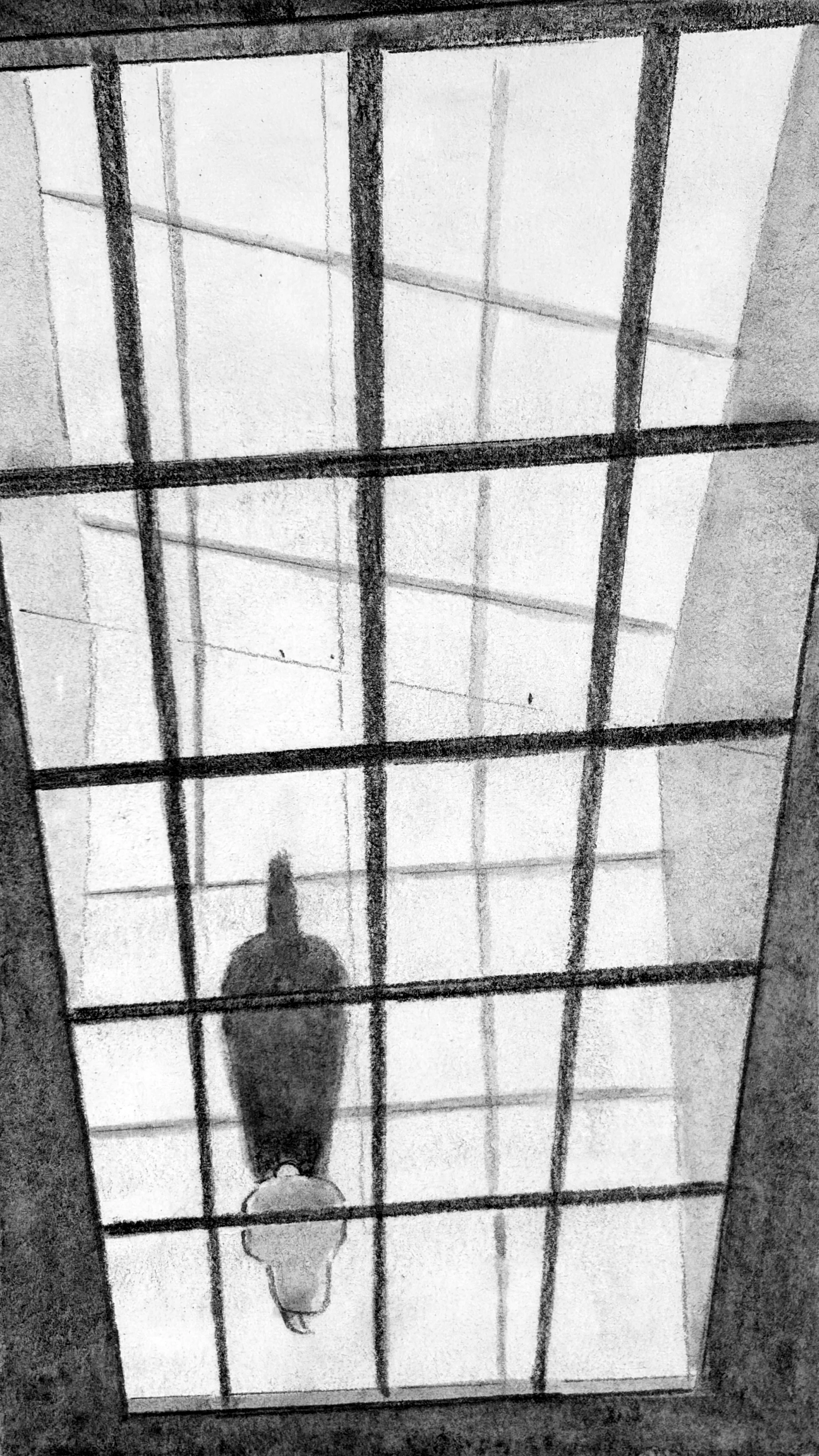 Looking through a tall industrial window into an abandoned warehouse. A small figure walks in silhouette.