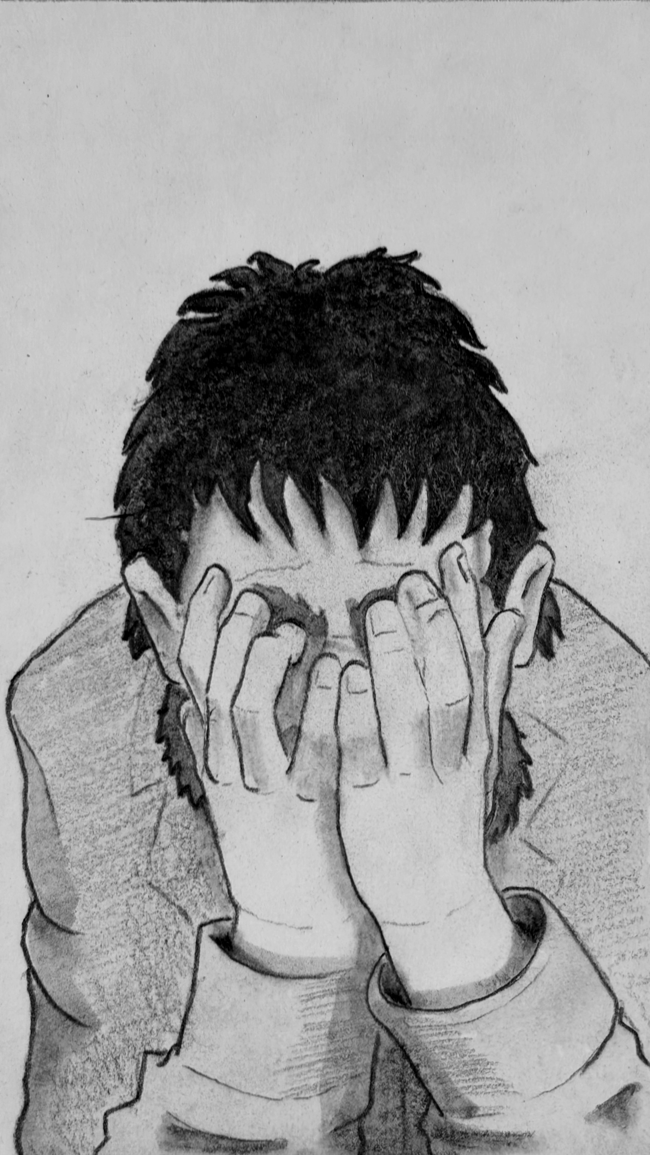 A close up of Glyn as he buries his face in his hands, sobbing.