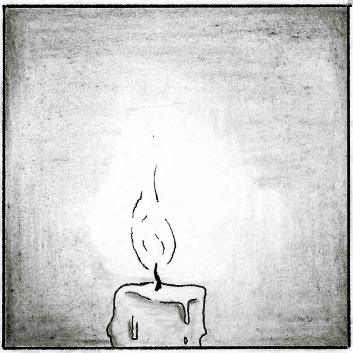 A close up of the candle, it has burned down, almost to the bottom.