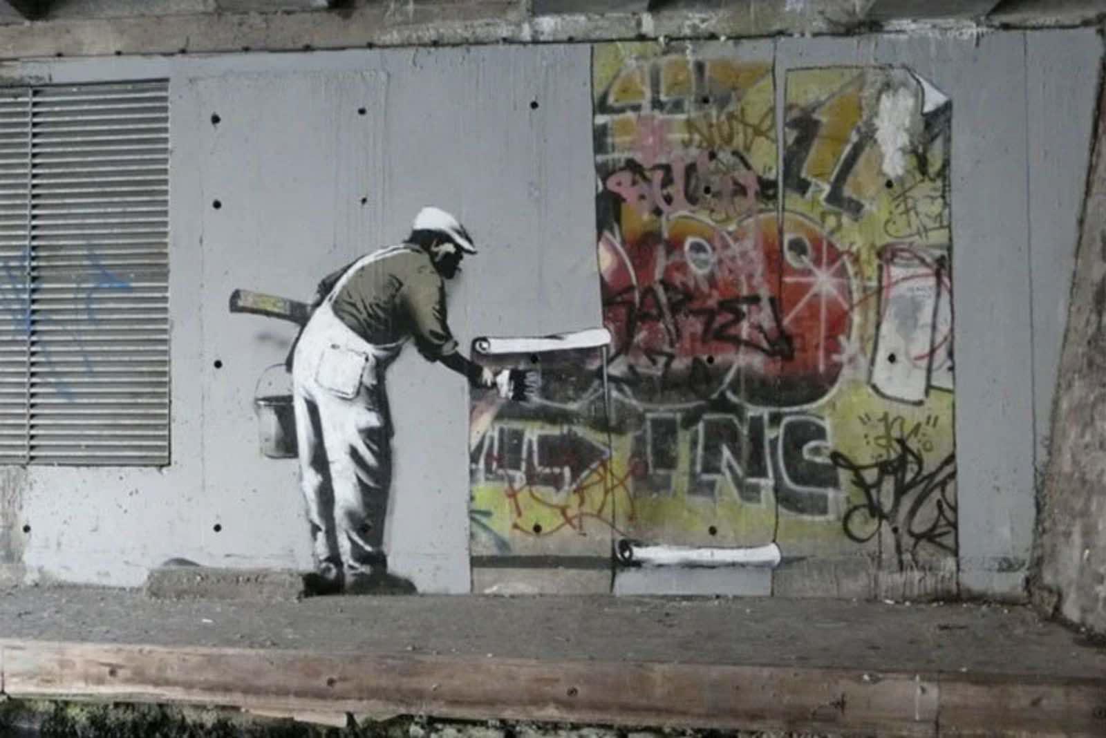 Street art by Banksy on the Regent’s Canal, London