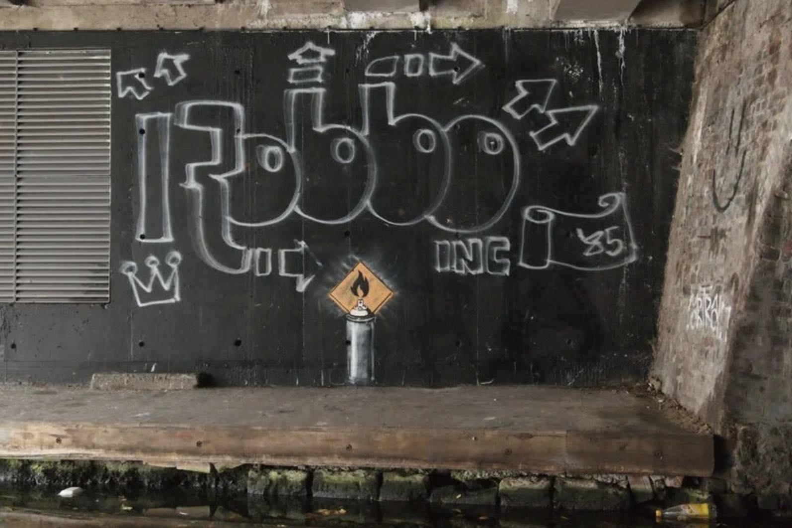 Street art by Banksy on the Regent’s Canal, London