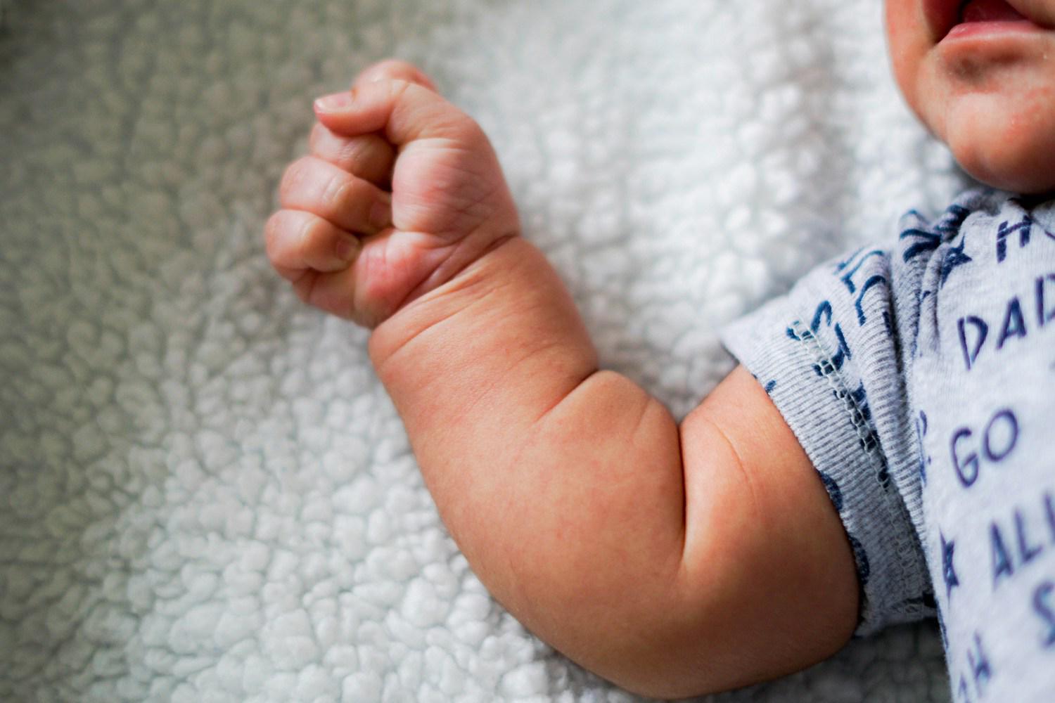 A stock photograph of a newborn baby&rsquo;s hand