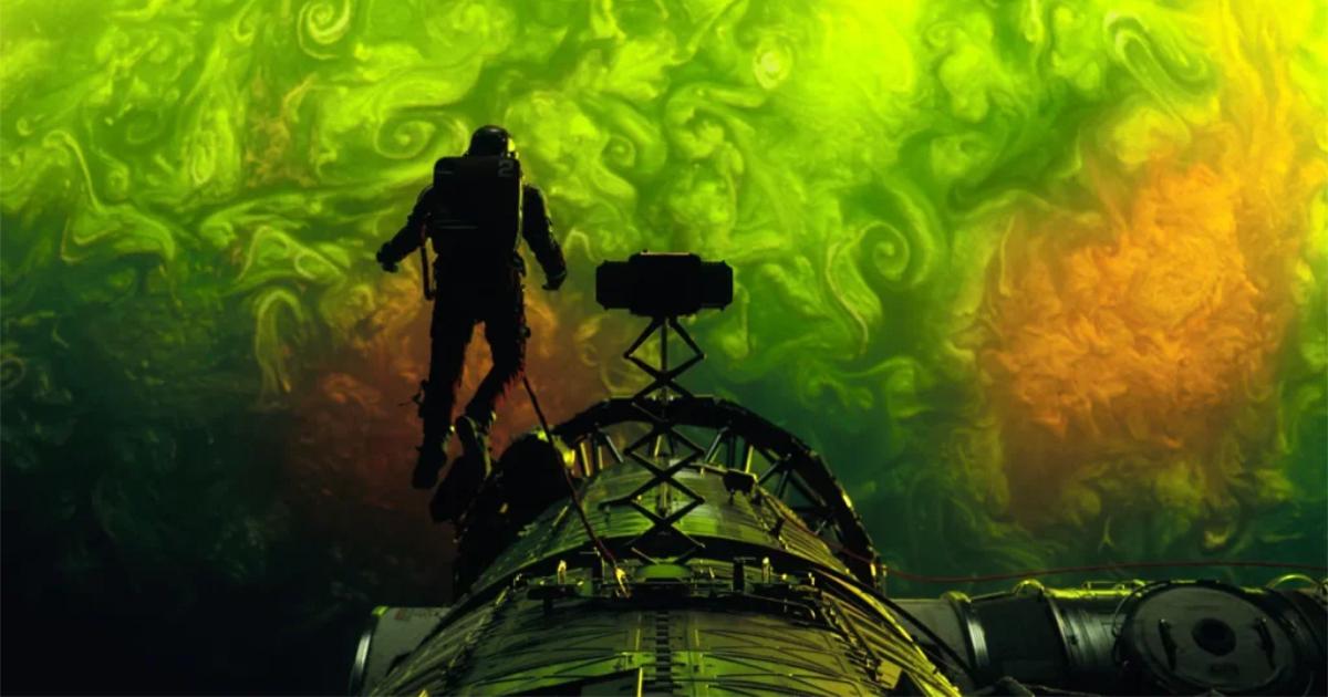 A frame from Project Hail Mary showing Ryan Gosling drifting through astrophages.